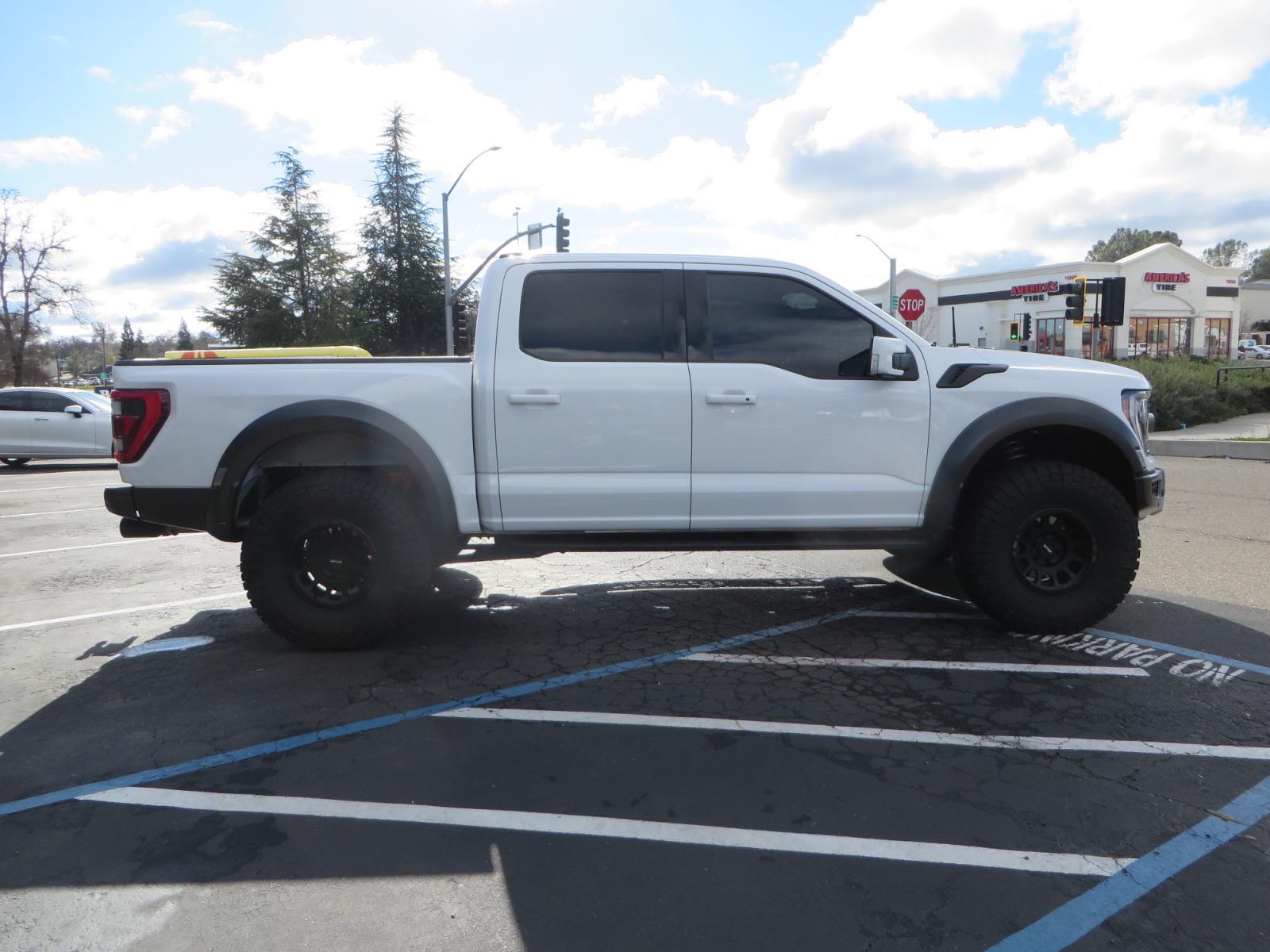 2023 White /BLACK Ford F-150 Raptor SuperCrew 4WD (1FTFW1RG6PF) with an 3.5 V6 engine, 6A transmission, located at 2630 Grass Valley Highway, Auburn, CA, 95603, (530) 508-5100, 38.937893, -121.095482 - Raptor sitting on Eibach front and rear springs, 37" Nitto Ridge Grappler tires, 17" Method NV wheels, and window tint. - Photo #3